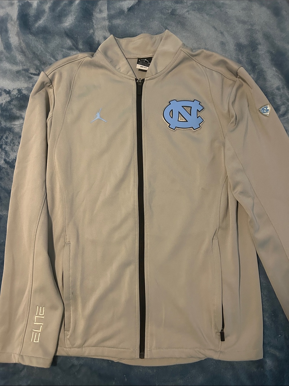 Jordan Men's Grey Windbreaker with Carolina Blue Logos